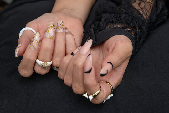Nail Design . Manicure nail paint . Beautiful female hand with colorful nail art design manicure. no Face