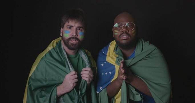 Friends wearing Brazilian clothes, football fans, anxious, nervous, distressed. World Cup, Olympics. 4K Premium Cinematic Video.