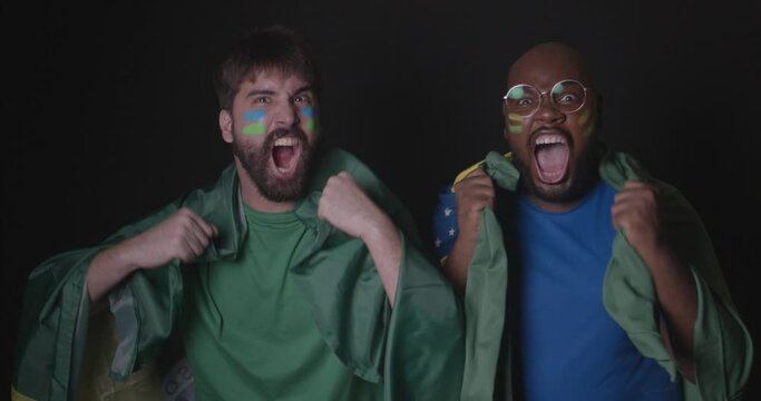 Friends wearing brazilian clothes, soccer fan, chanting goal together, goal, victory shout, point shout. World Cup, Olympics. 4K Premium Cinematic Video.