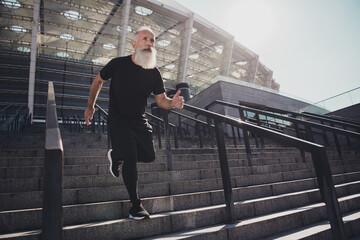 Full length body size view of attractive virile confident motivated grey-haired man running...