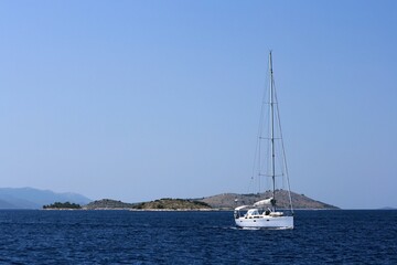 Obraz premium sailing boat in front of the lovely islands in national park Kornati, Croatia