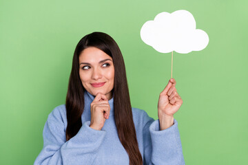 Photo of sweet young brunette lady look clouds wear blue turtleneck isolated on green color background