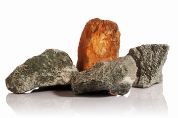 Raw rock fragments on a white background.