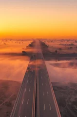 Abwaschbare Fototapete Orange Sonnenuntergang über der Autobahn