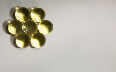 solated capsules in the form of balls on a background of shadows and light like a round polyhedron in different colors