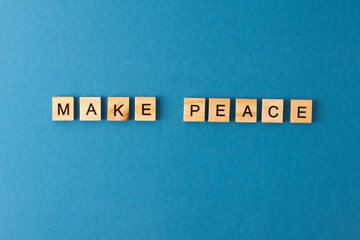 Make peace background. Phrase from wooden letters. Top view words. The phrases is laid out in wood letter. Motivation.