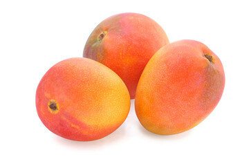 Three red - yellow mango isolated on white