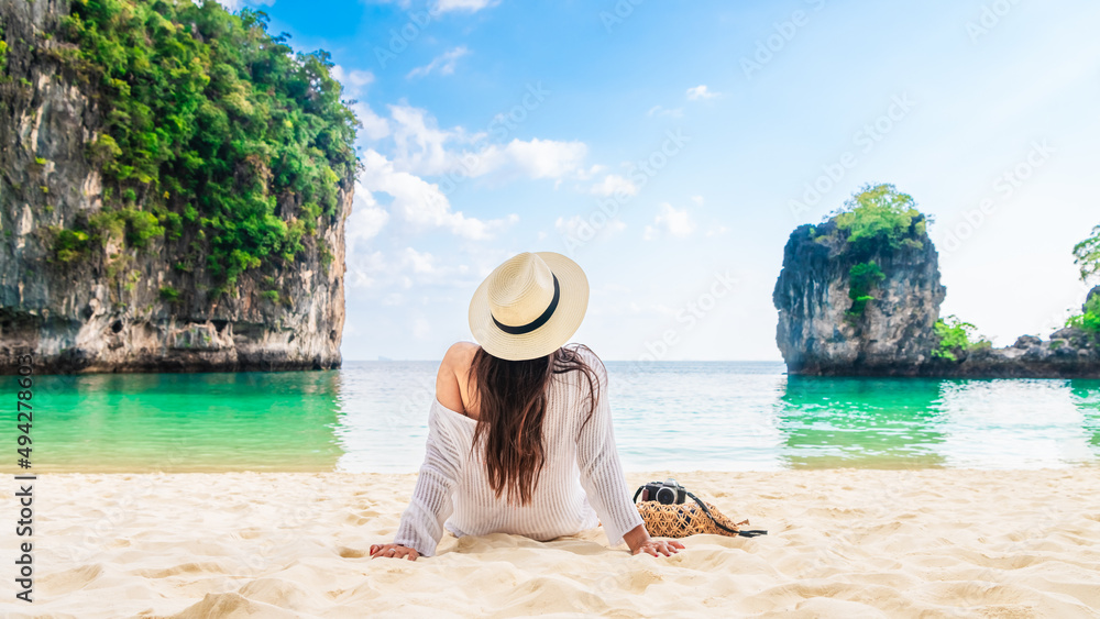 Wall mural Happy traveler woman relaxing on vacation beach joy nature view scenic landscape Hong island Krabi, Attraction famous place tourist travel Phuket Thailand summer holiday, Beautiful destination Asia