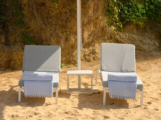 Beach hammocks, hotel relaxation area on beach sand