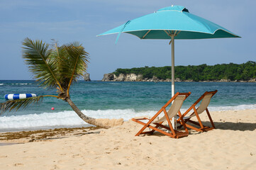 Two sun loungers on the beach for relaxation