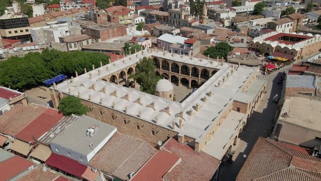Aerial 4k Nicosia Old Town with Great Inn(B&uuml;y&uuml;k Han) which is build as cervansarai by Ottoman Period in North Cyprus
