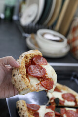 Pepperoni pizza in the kitchen