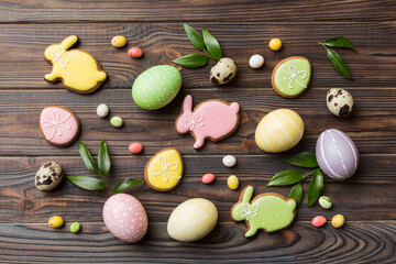 Fototapeta na wymiar holiday preparation Multi colors Easter eggs with cookies on colored background . Pastel color Easter eggs. holiday concept with copy space
