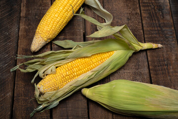 Dry vegetable food corn on wood table.