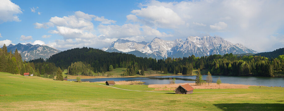 wide mountain landscape lake Geroldsee, wooden barns, Karwendel mountain view