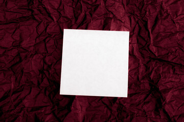 white blank note on crinkled notice board