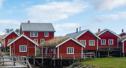 traditional red wooden rorbu houses in norway or north sweden