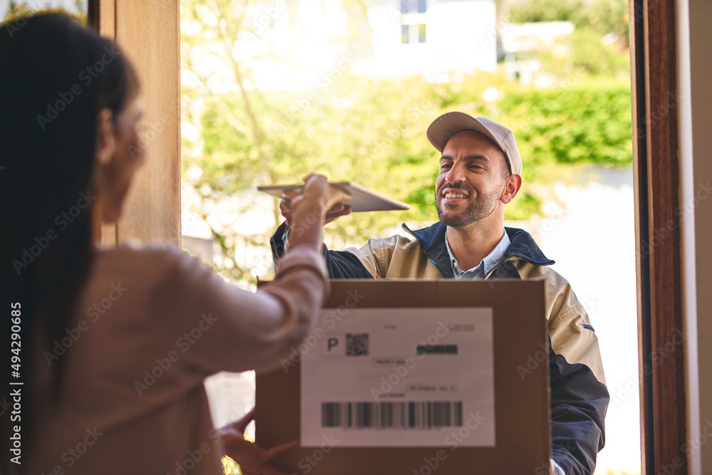 Poster weve gone completely paperless with our transactions. shot of a courier handing over a digital table