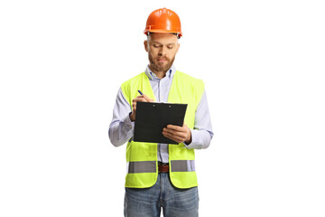 Male engineer with a safety vest and hardhat writing a document