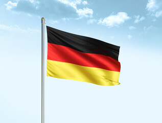 Germany national flag waving in blue sky with clouds. Germany flag. 3D illustration