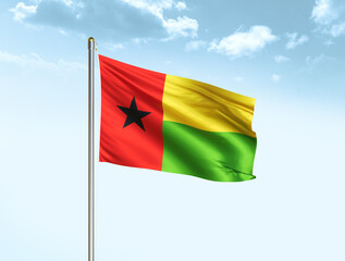 Fototapeta na wymiar Guinea Bissau national flag waving in blue sky with clouds. Guinea Bissau flag. 3D illustration