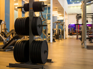 Fototapeta na wymiar Close up image of fitness equipment in the gym,barbell,barbell pancakes