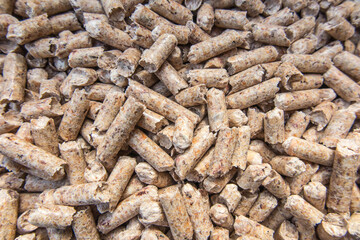 Wooden pellets used as fuel in ecological heating boilers.