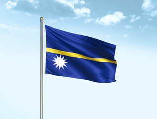 Nauru national flag waving in blue sky with clouds. Nauru flag. 3D illustration