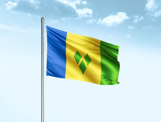 Saint Vincent and the Grenadines national flag waving in blue sky with clouds. Saint Vincent and the Grenadines flag. 3D illustration