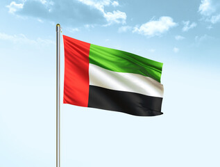 Fototapeta na wymiar United Arab Emirates national flag waving in blue sky with clouds. UAE flag. 3D illustration