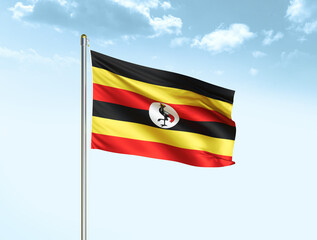 Uganda national flag waving in blue sky with clouds. Uganda flag. 3D illustration