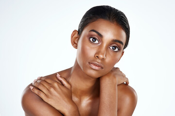 Skin care is the first step of self care. Studio shot of a beautiful young woman posing against a...
