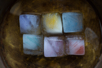 colorful ice cubes on a textured vintage background
