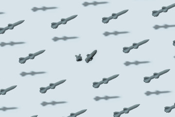 Toy cruise missiles. Set of rockets on grey background. Isolated rockets of gray color. Weapons for air bambarding. Rockets to attack from airplane. Broken missile in middle.