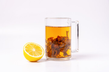glass with green tea and lemon slice on white background