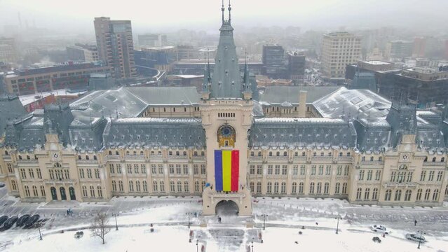Aerial footage of Cultural palace from Iasi, Romania. The palace was filmed from a drone while flying forward towards the palaces central tower. Video was shot in winter while snowing.