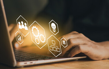 automation and workflow concept, businessman using laptop for working  and process workflow development on virtual screen.
