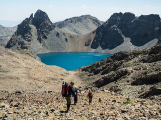 Fototapeta premium Mountain peak. Mountain landscape. Spring in the mountains. Mountain valley. Lake in the mountains. Mountain hike. Travel in the mountains. Mountain climbing. Tourists 