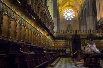 Fototapeta na wymiar The wooden Sevilla's Cathedral choir stalls