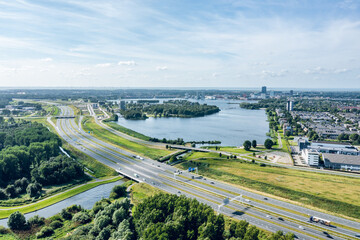 Aerial view on Almere city center, Weerwater lake, A6 highway and Floriade
