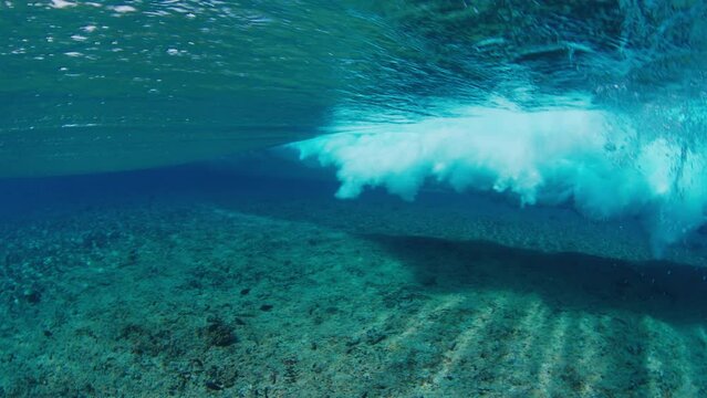 Ocean wave breaks over the reef in Maldives