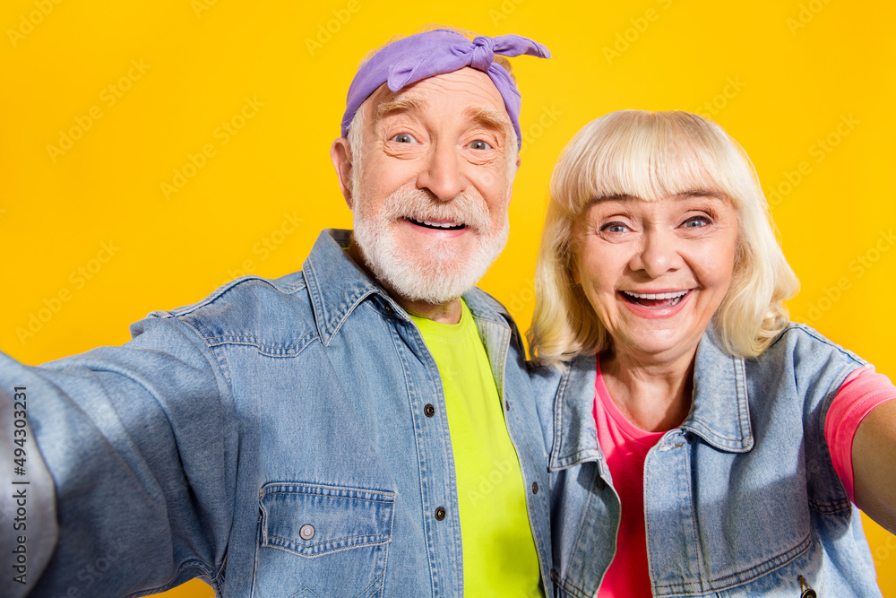 Sticker Photo of pretty cute retired husband wife wear jeans clothes taking selfie isolated yellow color background