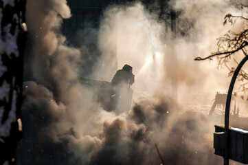 Smoke from fires and war on the streets in Kyiv