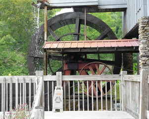 Gristmill water wheel at Saunooke Mill, a working stone ground mill beside the Oconaluftee River in Cherokee, North Carolina.