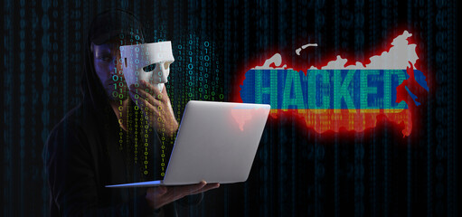 Hacker with laptop, map of Russia and computer code on dark background