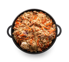 Frying pan with tasty Asian pilaf on white background