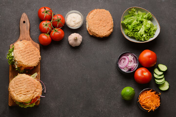 Fresh doner kebab in buns and ingredients on dark background