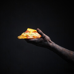 the make-up hand of the zombies holds the broken food of fast food. halloween concept