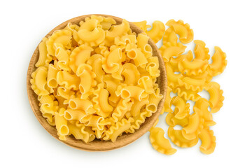 Pasta cornetti creste macaroni in wooden bowl isolated on white background with clipping path and full depth of field. Top view. Flat lay