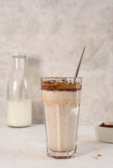 Delicious homemade cocoa drink with milk and cocoa powder. Vertical orientation.